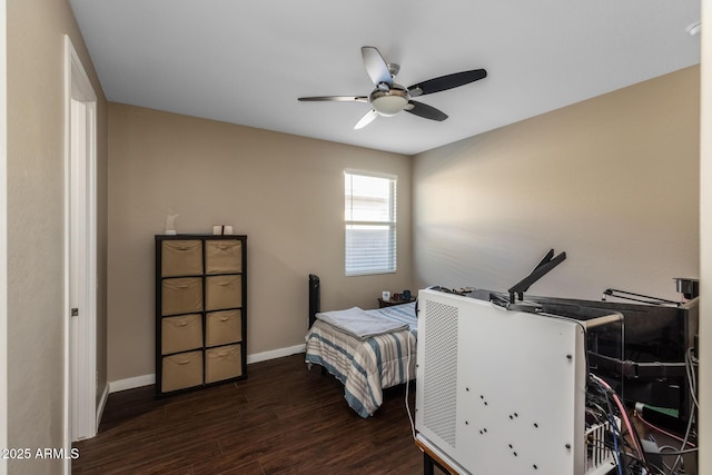 bedroom featuring dark wood-type flooring and ceiling fan