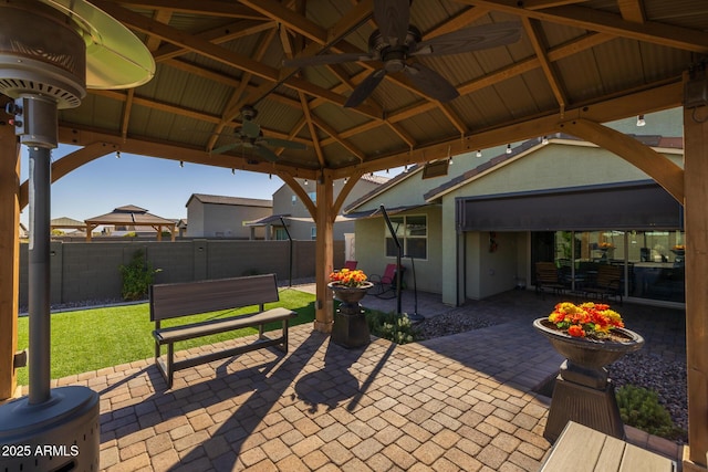 view of patio / terrace featuring a gazebo and ceiling fan