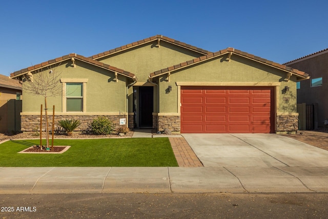 view of front facade with a garage and a front yard