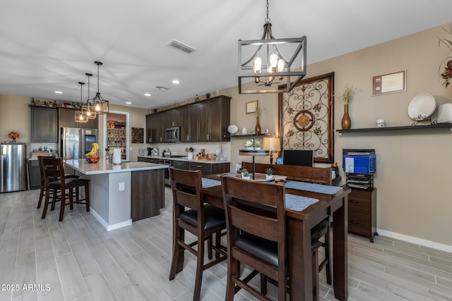 dining space featuring an inviting chandelier