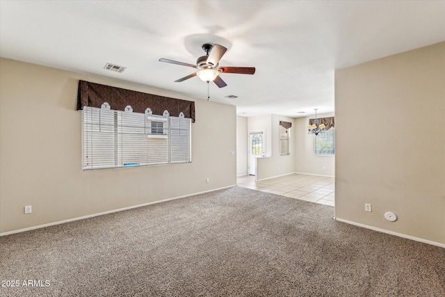 4380 E Renee Dr, Phoenix, AZ 85050 - spare room featuring a chandelier, ceiling fan, light carpet, baseboards, and light tile patterned flooring