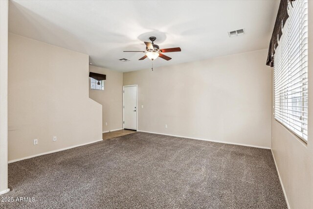 4380 E Renee Dr, Phoenix, AZ 85050 - spare room with ceiling fan, carpet floors, and baseboards
