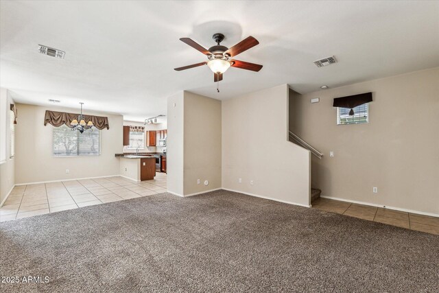 4380 E Renee Dr, Phoenix, AZ 85050 - unfurnished living room with light tile patterned flooring, light colored carpet, a chandelier, and a ceiling fan