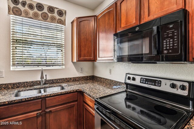4380 E Renee Dr, Phoenix, AZ 85050 - kitchen with black microwave, electric range, a sink, and dark stone counters