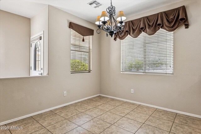 4380 E Renee Dr, Phoenix, AZ 85050 - spare room with a chandelier, plenty of natural light, light tile patterned floors, and baseboards