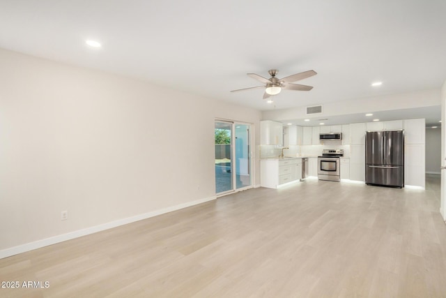 1906 N Evergreen St, Chandler, AZ 85225 - unfurnished living room with a ceiling fan, recessed lighting, light wood-type flooring, a sink, and baseboards