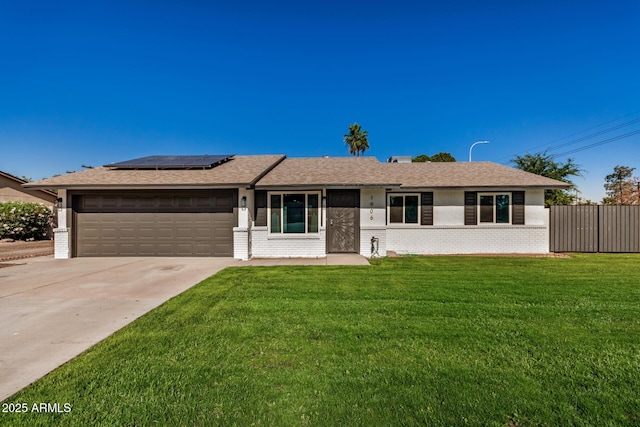 1906 N Evergreen St, Chandler, AZ 85225 - single story home with an attached garage, solar panels, brick siding, concrete driveway, and roof with shingles