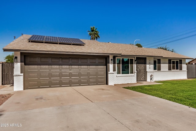 1906 N Evergreen St, Chandler, AZ 85225 - single story home with solar panels, brick siding, an attached garage, a front yard, and driveway
