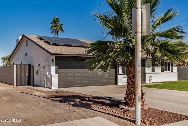 1906 N Evergreen St, Chandler, AZ 85225 - single story home featuring brick siding, driveway, an attached garage, and solar panels