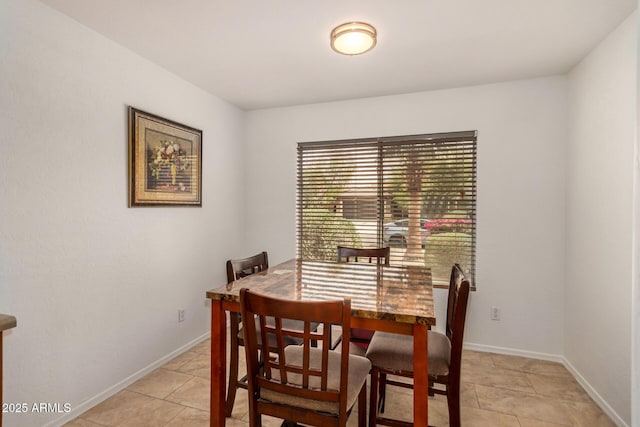 5220 W Desert Ln, Laveen, AZ 85339 - dining space featuring light tile patterned floors and baseboards