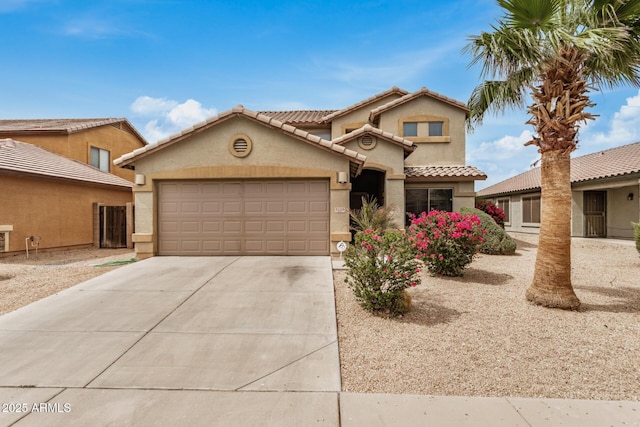 5220 W Desert Ln, Laveen, AZ 85339 - view of front of home with stucco siding, an attached garage, concrete driveway, and a tile roof