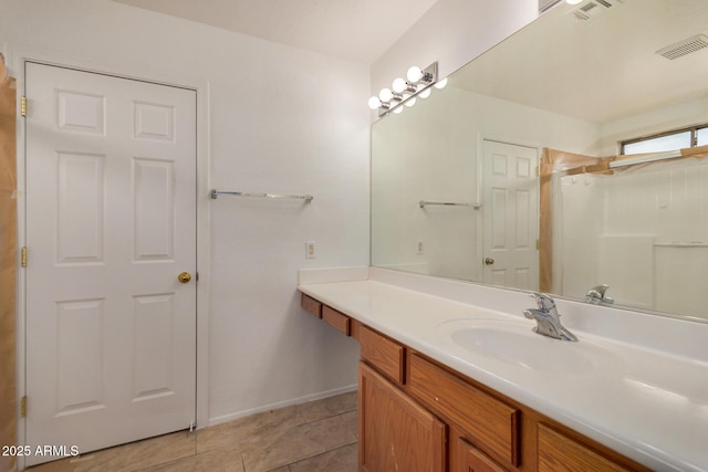 5220 W Desert Ln, Laveen, AZ 85339 - full bathroom with vanity, tile patterned floors, and baseboards