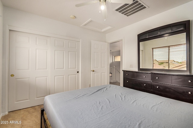 5220 W Desert Ln, Laveen, AZ 85339 - bedroom with attic access, a closet, light tile patterned flooring, and ceiling fan