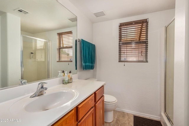 5220 W Desert Ln, Laveen, AZ 85339 - full bathroom featuring toilet, vanity, a stall shower, and baseboards