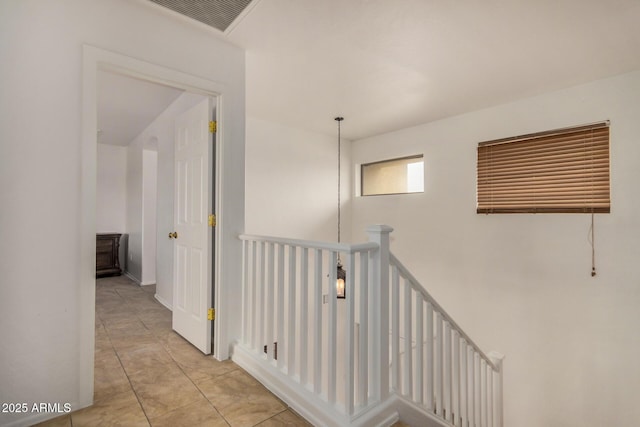 5220 W Desert Ln, Laveen, AZ 85339 - hall featuring an upstairs landing and tile patterned floors