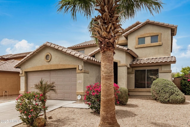 5220 W Desert Ln, Laveen, AZ 85339 - view of front facade featuring an attached garage, stucco siding, a tile roof, and concrete driveway