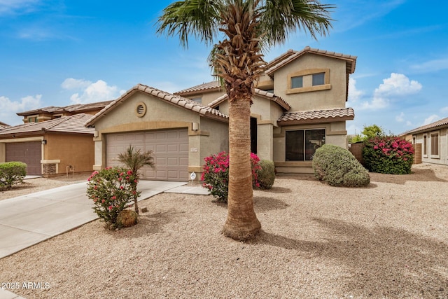 5220 W Desert Ln, Laveen, AZ 85339 - view of front of home featuring an attached garage, stucco siding, driveway, and a tiled roof