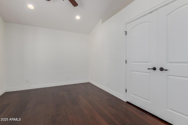unfurnished bedroom with baseboards, recessed lighting, and dark wood finished floors