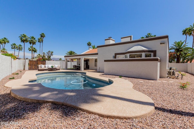 view of pool with a fenced backyard, a fenced in pool, a patio area, and outdoor lounge area