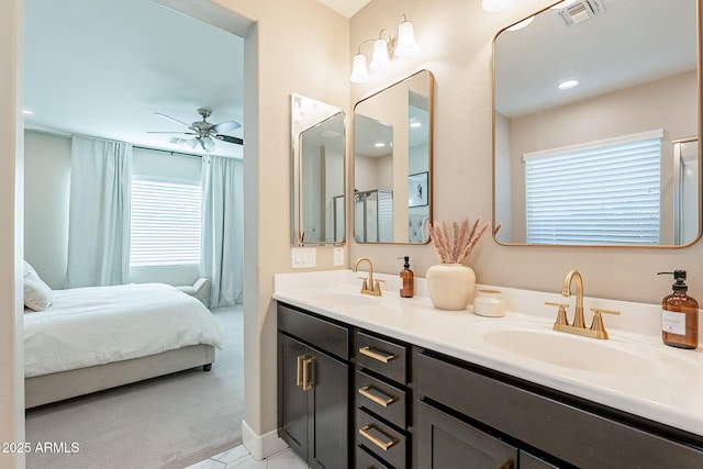 bathroom with ceiling fan and vanity