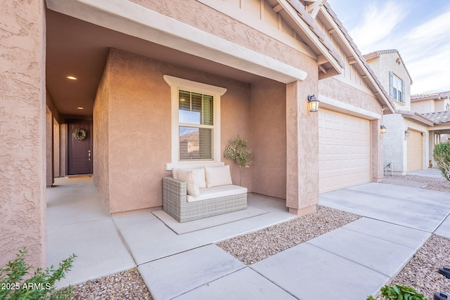 view of exterior entry featuring a garage