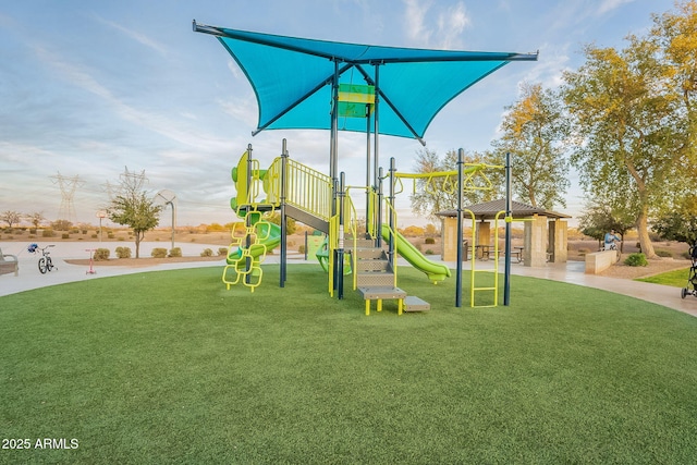 view of jungle gym with a water view and a yard