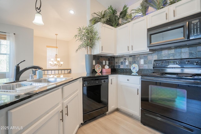 34979 N 30th Ave, Phoenix, AZ 85086 - kitchen featuring black appliances, a sink, backsplash, white cabinetry, and a chandelier