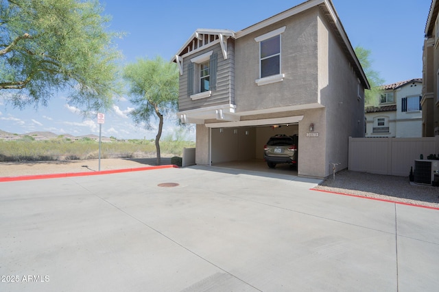 34979 N 30th Ave, Phoenix, AZ 85086 - view of front of home featuring a garage, cooling unit, stucco siding, and driveway