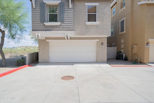34979 N 30th Ave, Phoenix, AZ 85086 - view of front facade featuring a garage, stucco siding, driveway, and cooling unit
