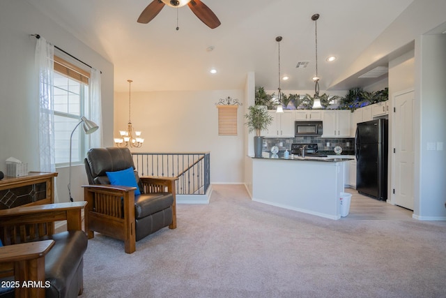 34979 N 30th Ave, Phoenix, AZ 85086 - kitchen with black appliances, light colored carpet, a chandelier, white cabinetry, and a ceiling fan