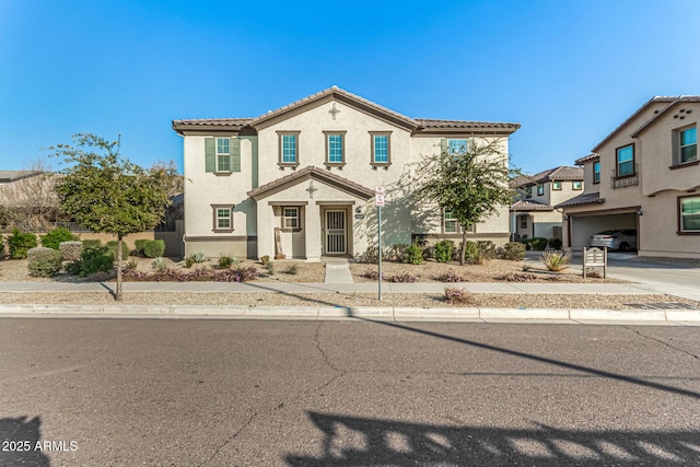 mediterranean / spanish-style home featuring a garage