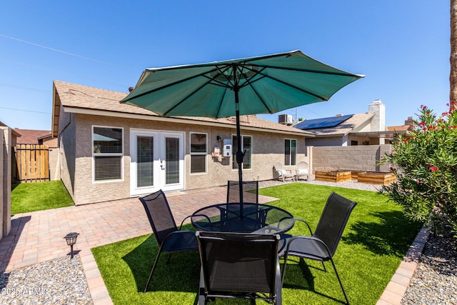 14235 N 26th Ln, Phoenix, AZ 85023 - back of house featuring stucco siding, a patio area, french doors, and a fenced backyard