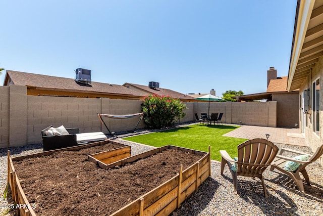 14235 N 26th Ln, Phoenix, AZ 85023 - fenced backyard featuring a vegetable garden and a patio