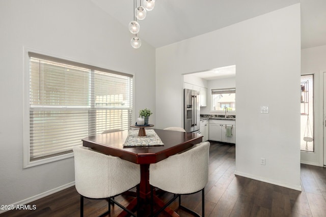 14235 N 26th Ln, Phoenix, AZ 85023 - dining area with dark wood-style flooring and lofted ceiling