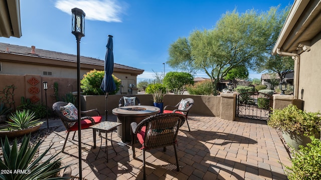 view of patio / terrace featuring a fire pit