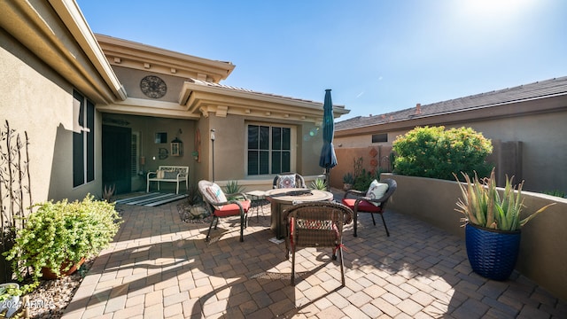 view of patio / terrace featuring an outdoor fire pit