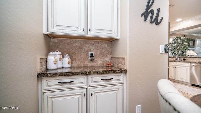 bar featuring white cabinetry, tasteful backsplash, ornamental molding, and stainless steel dishwasher