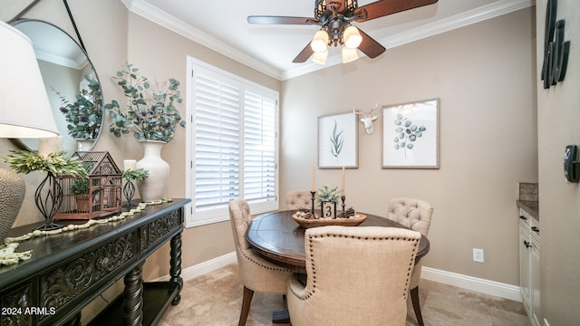 dining area featuring crown molding and ceiling fan