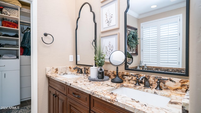 bathroom with vanity and crown molding