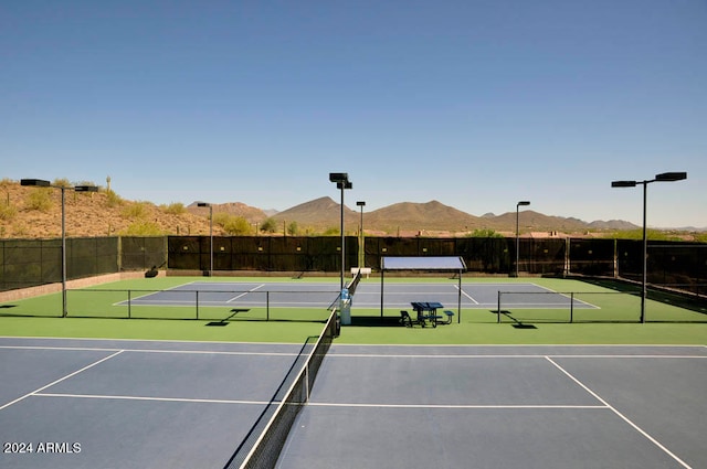 view of sport court with a mountain view