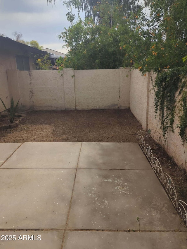 3807 W Mitchell Dr, Phoenix, AZ 85019 - fenced backyard featuring a patio area