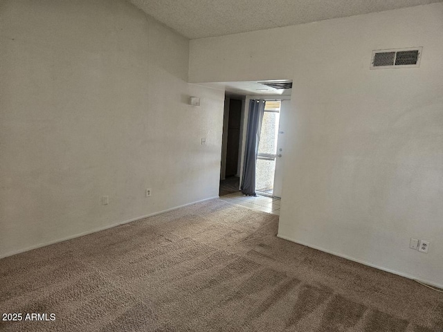 3807 W Mitchell Dr, Phoenix, AZ 85019 - spare room featuring light carpet and baseboards