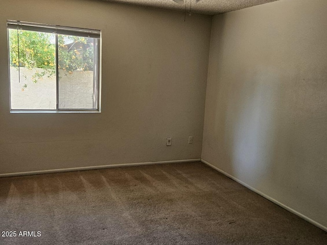 3807 W Mitchell Dr, Phoenix, AZ 85019 - carpeted spare room featuring baseboards and a ceiling fan