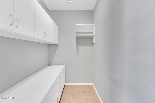 walk in closet featuring visible vents