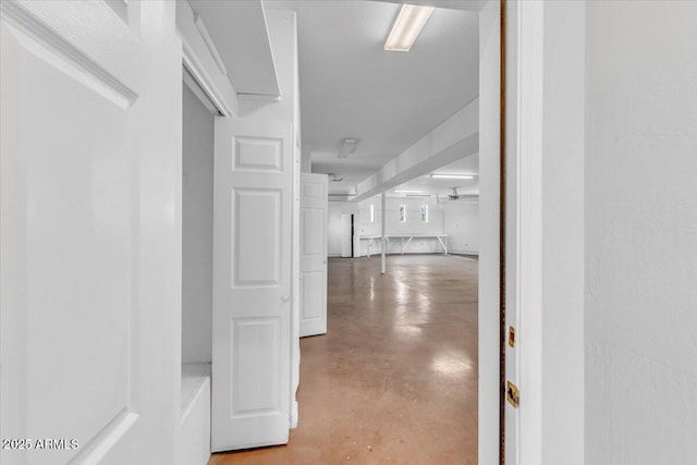 hallway featuring concrete flooring