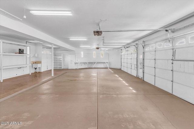 parking garage featuring a sink and a garage door opener