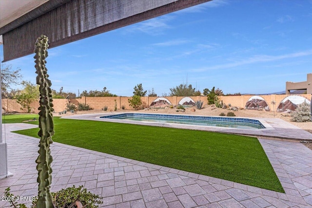 view of pool featuring a yard, a fenced backyard, and a fenced in pool