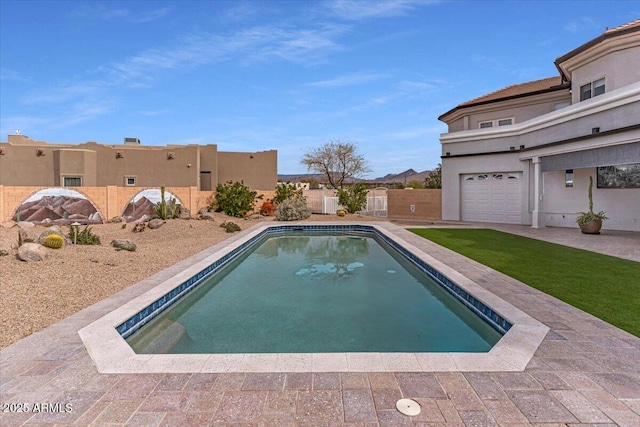 view of swimming pool with a residential view, a fenced backyard, and a fenced in pool