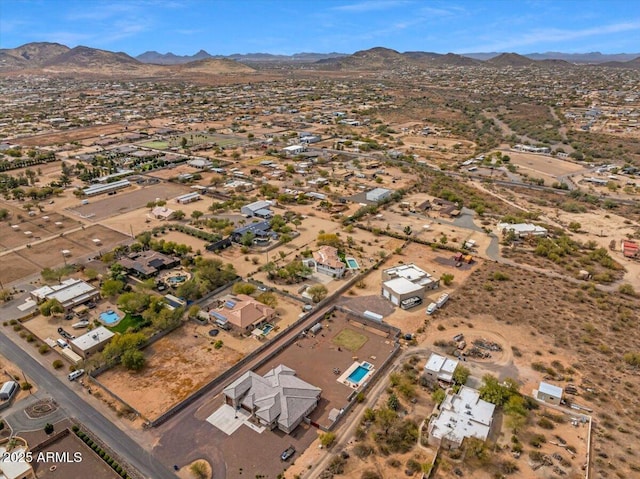 birds eye view of property with a mountain view