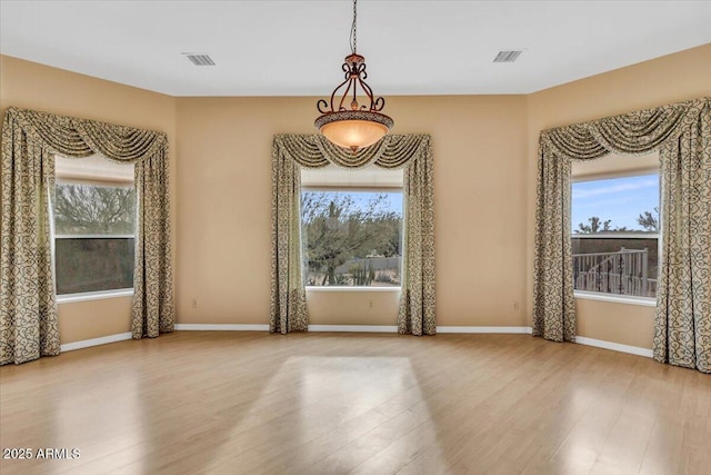 spare room featuring visible vents and a wealth of natural light